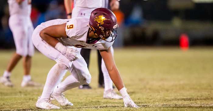 Elijah Rushing lines up for a play with Salpointe Catholic.